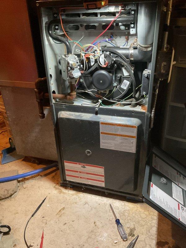 Performed annual heating maintenance on a 2019 Goodman 80,000 BTU, 92% AFUE gas furnace with enhanced blower, removing access panels to inspect the burner compartment, inducer assembly, gas valve, wiring, and venting, and completing a cleaning check. Conducted combustion analysis, recording CO at 11 ppm, CO2 at 8.1%, and excess air at 47.5%, with readings within normal operating range. Noted minor surface corrosion along the lower cabinet seam below the blower housing for monitoring.