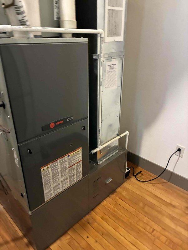 Performed a seasonal tune-up on a Trane gas furnace, including a complete cleaning and operational inspection of the unit. Found the air filter dirty and restricted, and replaced it with a customer-supplied filter to restore proper airflow. Verified the furnace cabinet, PVC venting and condensate piping, and electrical connections showed no signs of rust, leaks, or damage.