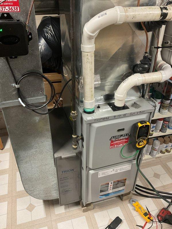 Performed a routine cleaning and safety inspection on a 2015 Lennox gas furnace, including verification of the venting and combustion air PVC piping, ductwork connections, control wiring, and the attached Trion Air Bear air cleaner. Also inspected the gas fireplace insert, finding the glass, ceramic logs, and surround in good condition with no soot, cracks, rust, or visible damage. Both units were left in satisfactory operating condition.