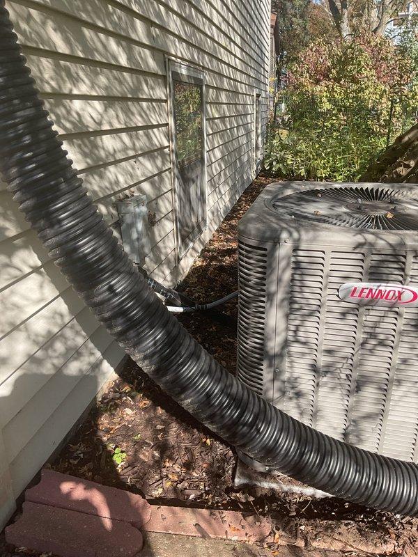 Performed annual maintenance on a 6-year-old Lennox heating and cooling system, including cleaning and inspecting the furnace and verifying proper operation. Cleaned the exterior of the outdoor condenser unit, which had accumulated dust, leaf debris, and mulch around the base. Noted a small patch of frost-like residue at the base of the condenser and a drainage line routed near the unit, and recommend monitoring for proper drainage and airflow.