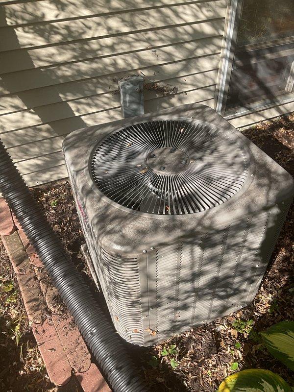 Performed annual maintenance on a 6-year-old Lennox heating and cooling system, including cleaning and inspecting the furnace and verifying proper operation. Cleaned the exterior of the outdoor condenser unit, which had accumulated dust, leaf debris, and mulch around the base. Noted a small patch of frost-like residue at the base of the condenser and a drainage line routed near the unit, and recommend monitoring for proper drainage and airflow.