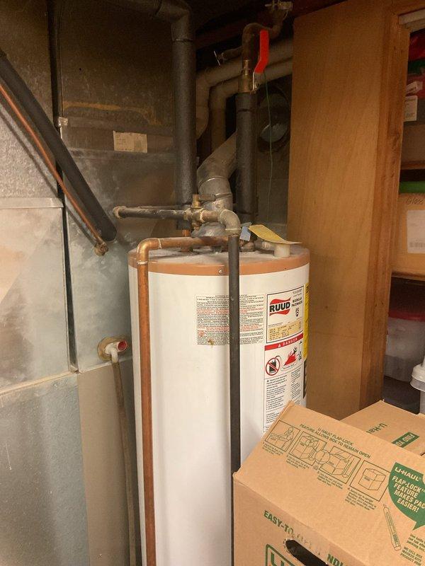 Performed a basic cleaning and inspection on a 2006 Carrier gas furnace, removing the front access panel to inspect the inducer motor, gas valve assembly, control board, pressure switch, wiring, and PVC vent connection. Cleaned light dust and grime from the furnace cabinet and surrounding ductwork, and verified the unit was reassembled and ready for operation.