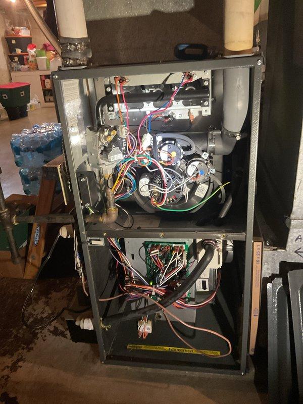 Performed a furnace tune-up and inspection on an upright gas furnace, including inspection of the burner and heat exchanger assembly, gas valve, inducer motor, control board wiring, and PVC vent connections. Inspected the condensate drain system and condensate pump to verify proper drainage, and confirmed the furnace operated correctly through a heating cycle.