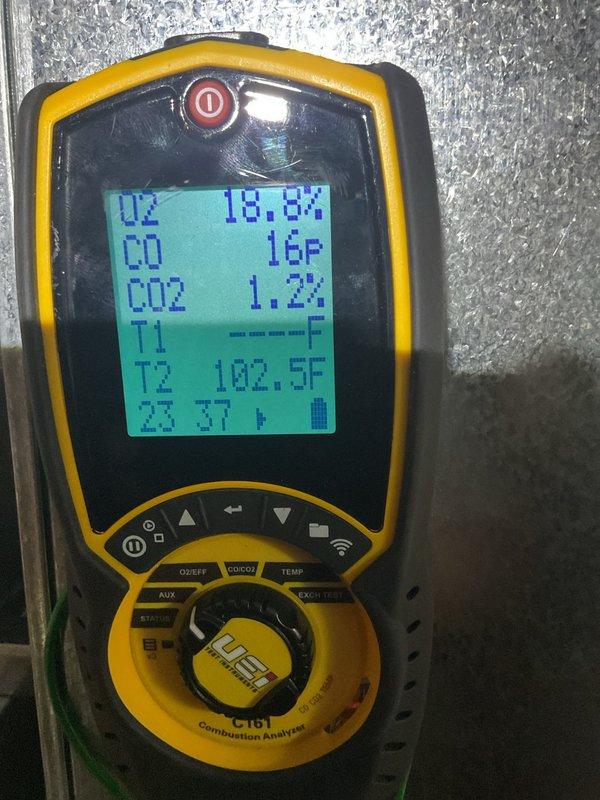 Performed annual heating maintenance on a 15-year-old Ruud gas-fired furnace, including cleaning and a full operational inspection. Conducted a combustion analysis (O2 18.8%, CO 16 ppm, CO2 1.2%) to verify safe burner operation. Noted heavy rust and corrosion on nearby metal components and wiring in the cramped mechanical area, and found the unit in generally rough condition due to age.
