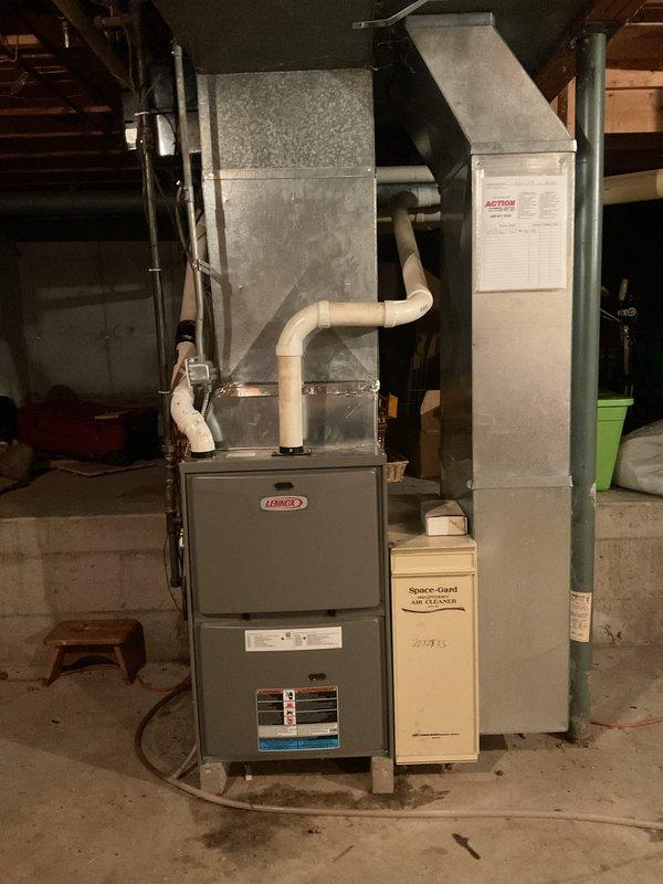 Diagnosed a failed heat exchanger on the Lennox gas furnace and presented a repair recommendation, which was approved. The heat exchanger replacement is covered under manufacturer warranty, and the job is pending delivery of the warranty part. Documented the furnace condition and noted moisture present on the floor at the base of the unit.
