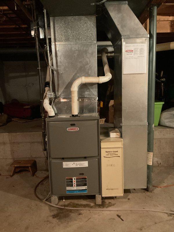 Diagnosed a failed heat exchanger on the Lennox gas furnace and presented a repair recommendation, which was approved. The heat exchanger replacement is covered under manufacturer warranty, and the job is pending delivery of the warranty part. Documented the furnace condition and noted moisture present on the floor at the base of the unit.