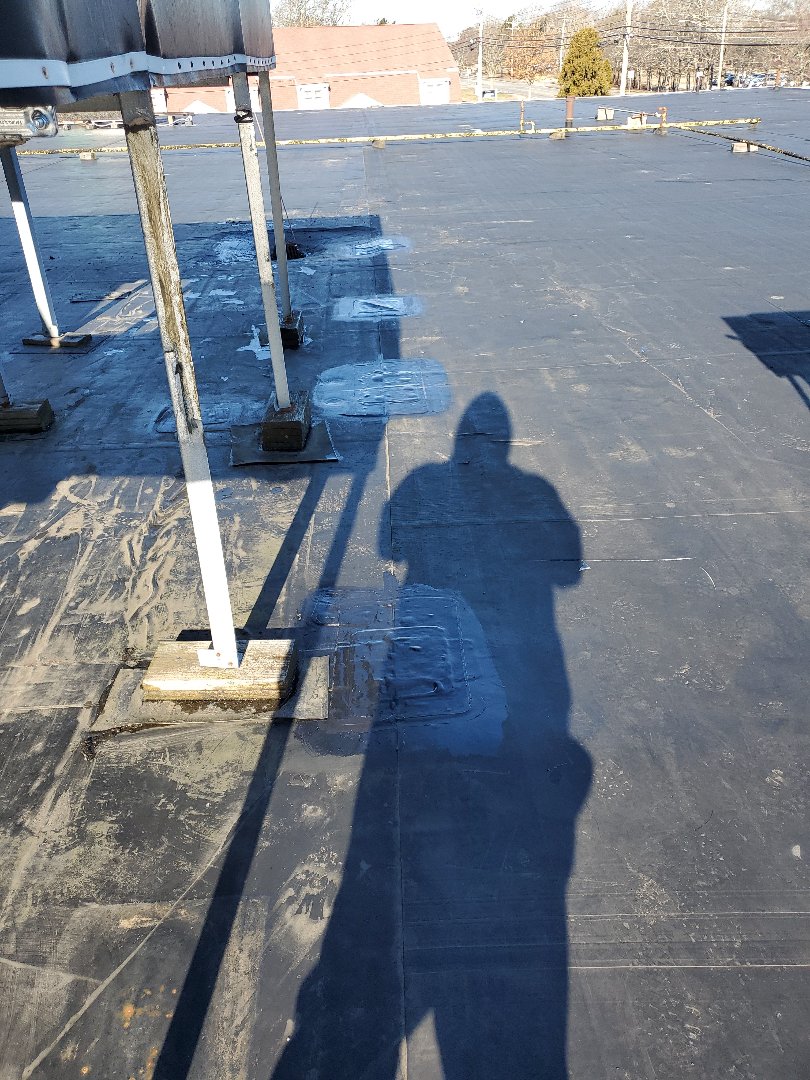 Barnstable, MA - repatched lifting T patches on adhered carlisle rubber roof Barnstable, MA - repatched lifting T patches on adhered carlisle rubber roof