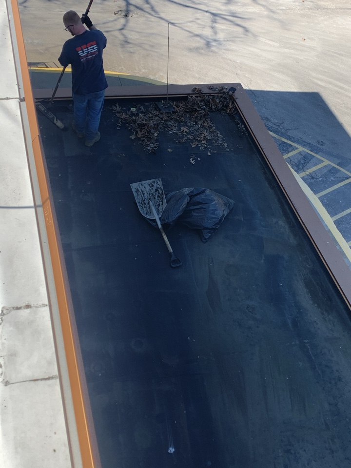 Boston, MA - Cleaning drains and debris off roof Boston, MA - Cleaning drains and debris off roof