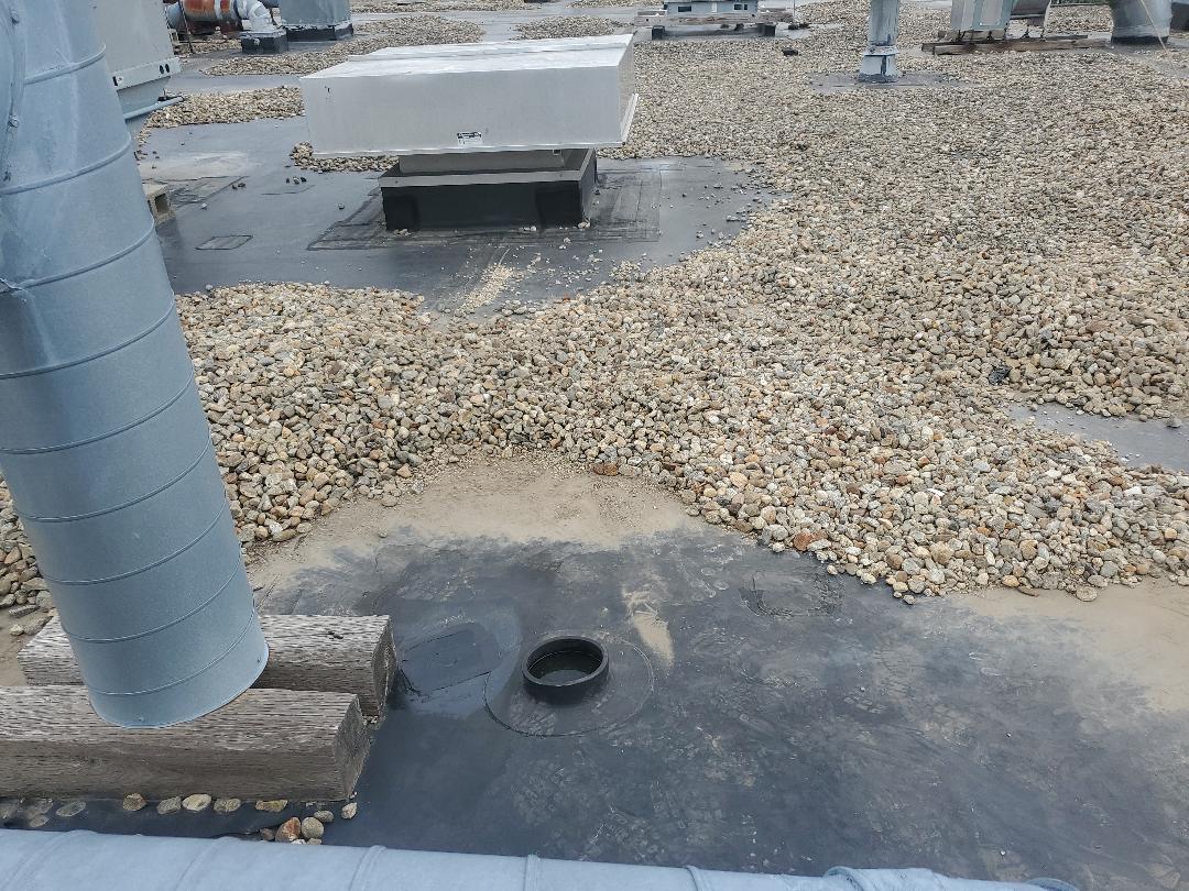 Billerica, MA - Carlisle epdm ballast patching holes after rain Billerica, MA - Carlisle epdm ballast patching holes after rain