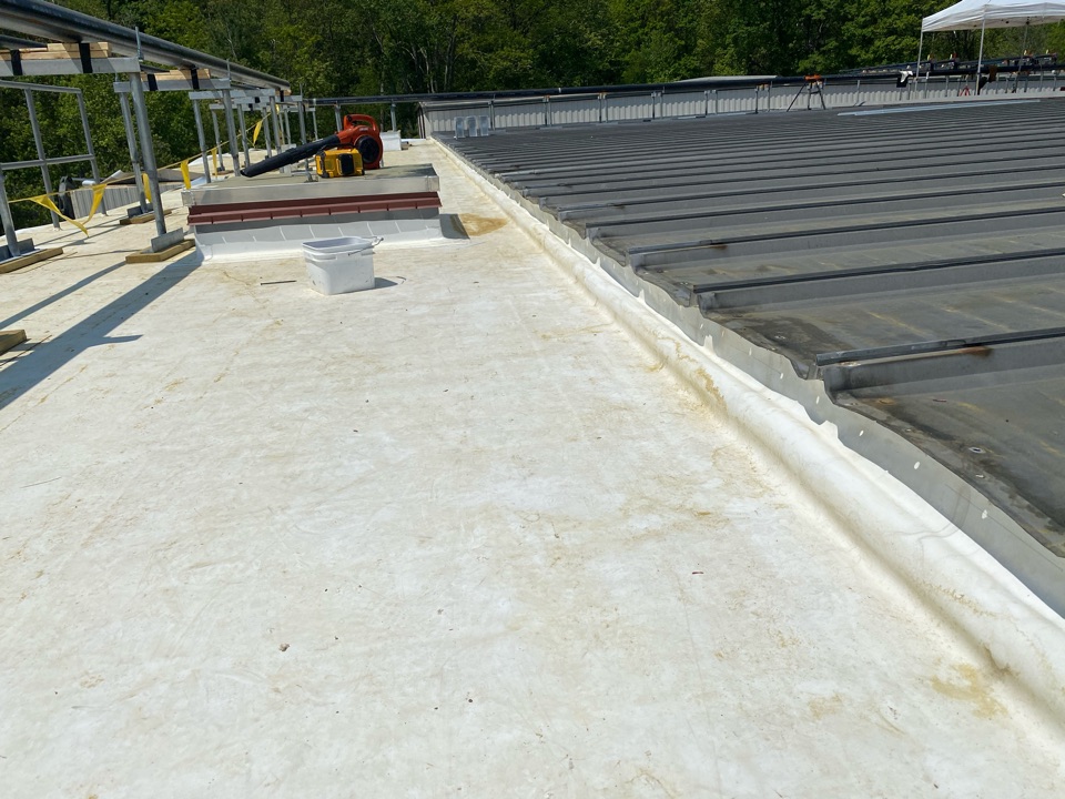 North Andover, MA - Wall detailing on a Firestone TPO roofing system North Andover, MA - Wall detailing on a Firestone TPO roofing system