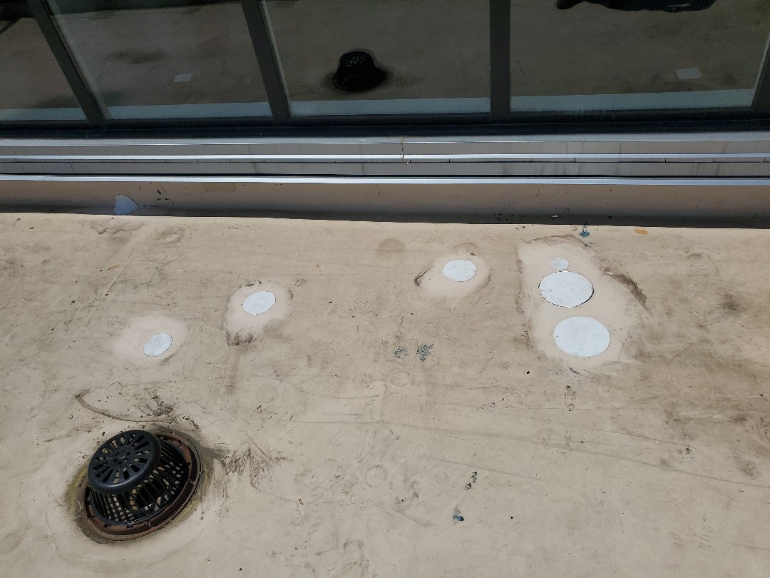 Boston, MA - patched holes near drain in TPO membrane Boston, MA - patched holes near drain in TPO membrane