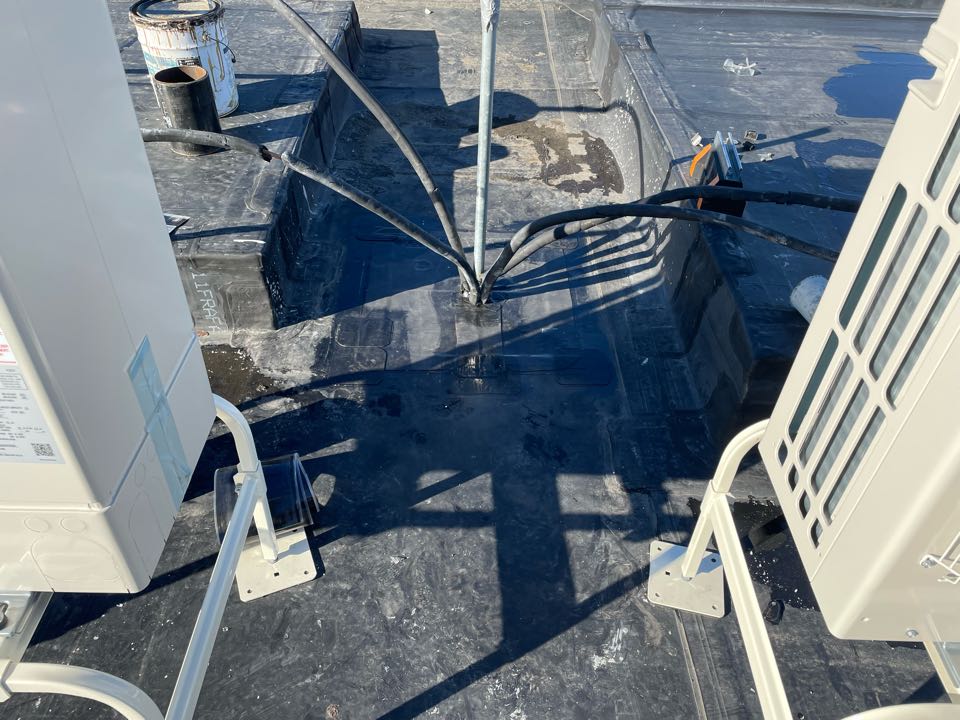 Boston, MA - Cleaned and target patched area after coring of concrete was done for a pitch pocket on an epdm fully adhered roofing system Boston, MA - Cleaned and target patched area after coring of concrete was done for a pitch pocket on an epdm fully adhered roofing system
