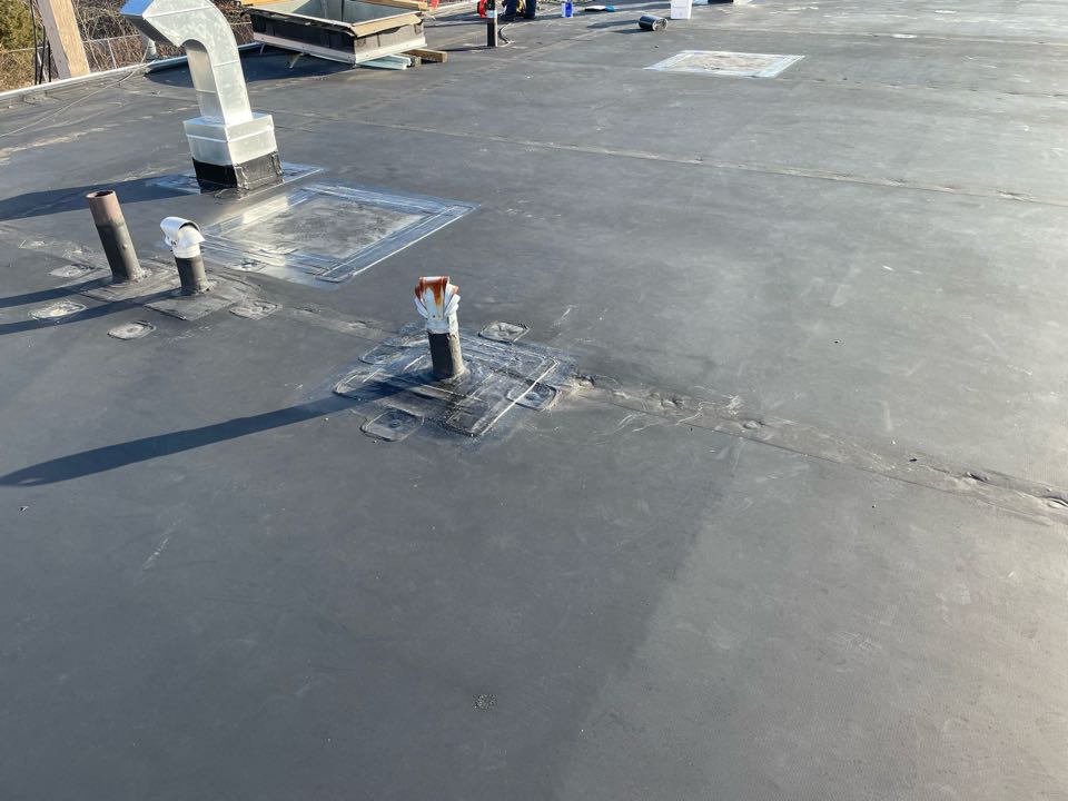Lowell, MA - Cleaned and patched 4 holes along roof edge . Cleaned, patched with 6”elastoform, and lap sealed. On a epdm fully adhered roofing system Lowell, MA - Cleaned and patched 4 holes along roof edge . Cleaned, patched with 6”elastoform, and lap sealed. On a epdm fully adhered roofing system