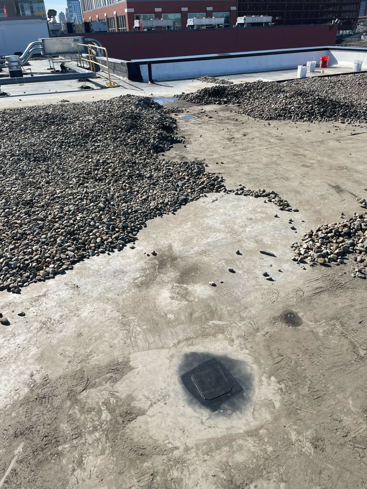 Boston, MA - Removed ballast in leak area. Found two holes in leak area. Cleaned and patched with 6” elastoform on a epdm ballast roofing system Boston, MA - Removed ballast in leak area. Found two holes in leak area. Cleaned and patched with 6” elastoform on a epdm ballast roofing system