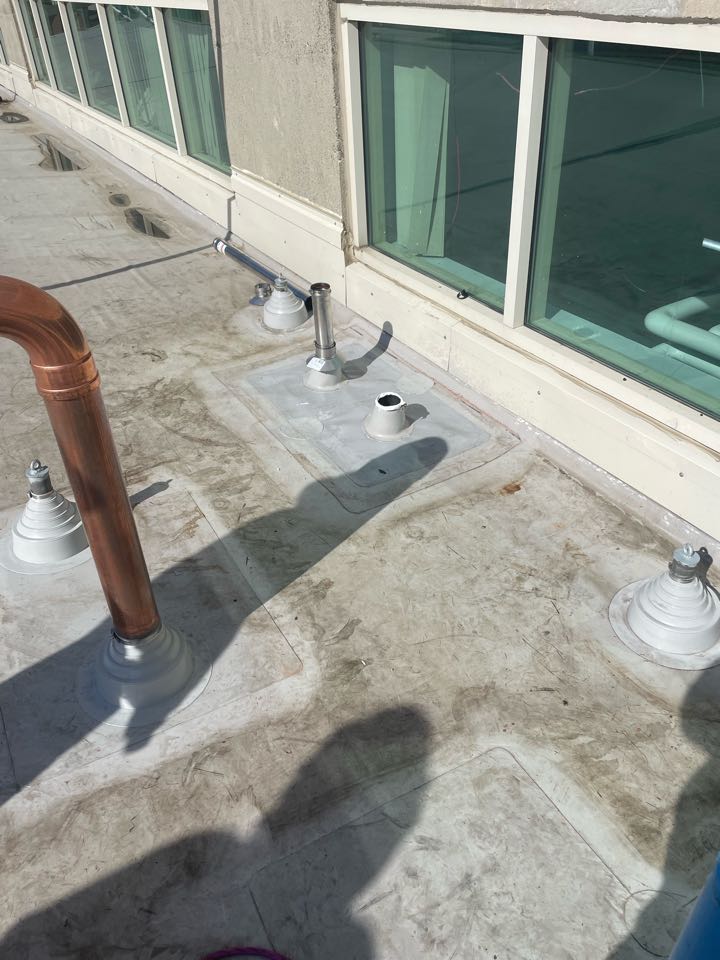 Boston, MA - Cleaned and Installed two new 3” cones on a gray pvc Rynobond roofing system. Boston, MA - Cleaned and Installed two new 3” cones on a gray pvc Rynobond roofing system.