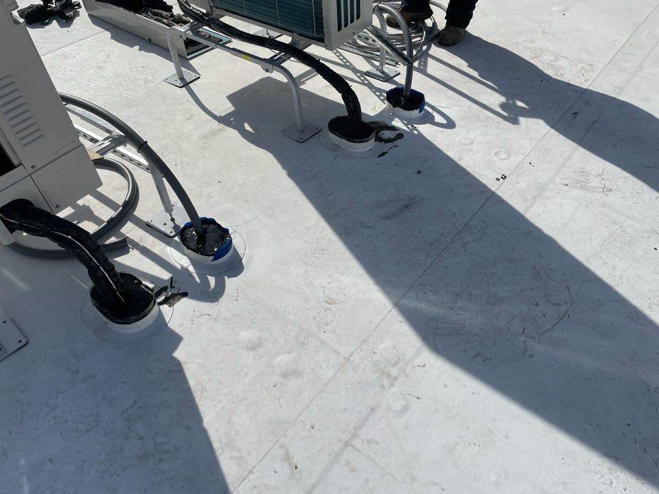 Lawrence, MA - Cleaned and installed two TPO pitch pockets and filled with pourable sealer on a TPO Rynobond roofing system Lawrence, MA - Cleaned and installed two TPO pitch pockets and filled with pourable sealer on a TPO Rynobond roofing system
