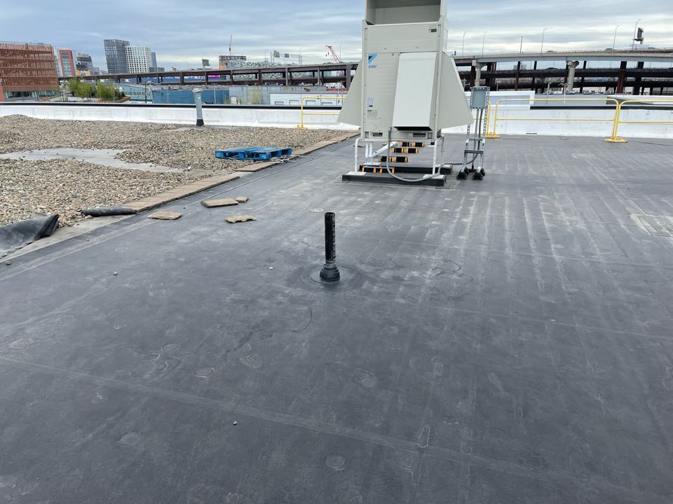 Boston, MA - Cleaned and installed 1 epdm pipe boot on a epdm fully adhered roofing system Boston, MA - Cleaned and installed 1 epdm pipe boot on a epdm fully adhered roofing system