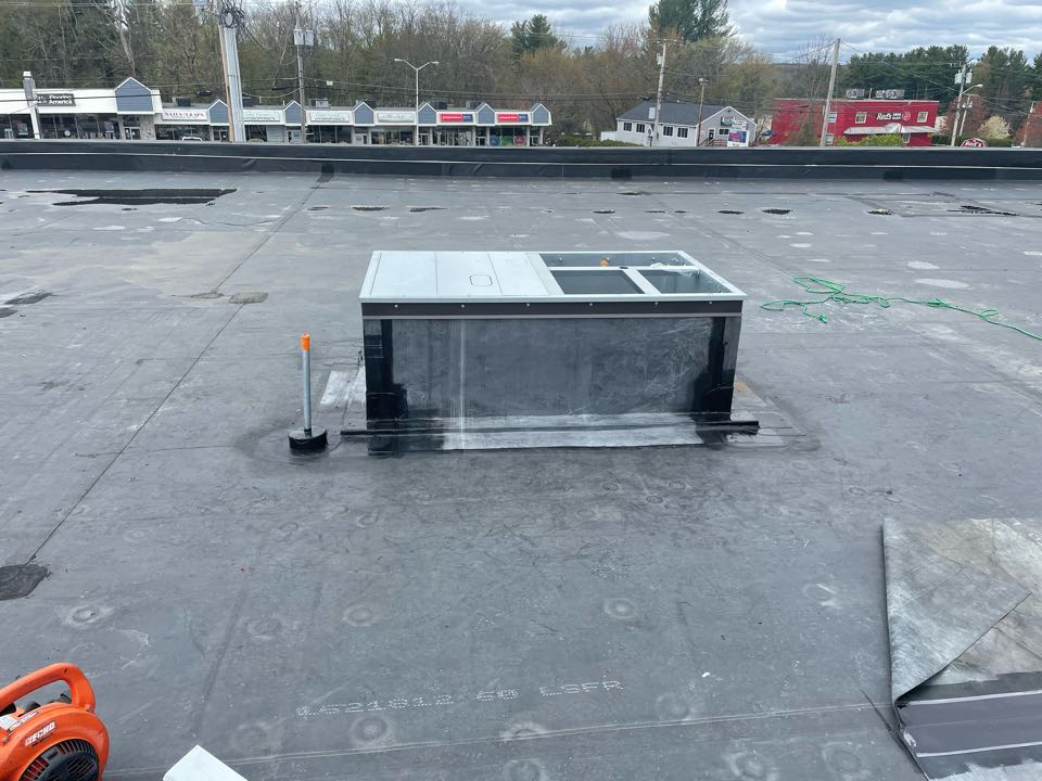 Plaistow, NH - Cleaned and installed curb on a epdm fully adhered roofing system. Plaistow, NH - Cleaned and installed curb on a epdm fully adhered roofing system.