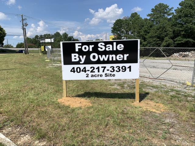 For sale post and panel sign installed