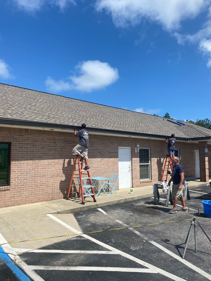 Subway in Gulfbreeze Florida installing Bon 6 inch seamless gutters Subway in Gulfbreeze Florida installing Bon 6 inch seamless gutters