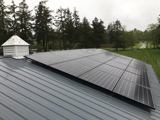 Working on a solar installation at a residence in Oak Harbor, WA