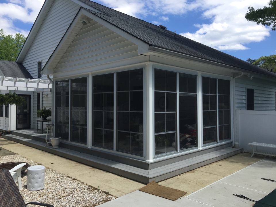 Middle Township, NJ - These vertical 4-track windows and door just converted this outdoor space to a 3-season room. The stackable panels will provide protection from wind and rain and the screens will keep out the mosquitoes, no-see-umm, greenheads and flies. For many years Miami Somers has been installing patio rooms and porch enclosure systems. Call us today and let us show you how we can improve your outdoor living experience, 609 927-4133. Middle Township, NJ - These vertical 4-track windows and door just converted this outdoor space to a 3-season room. The stackable panels will provide protection from wind and rain and the screens will keep out the mosquitoes, no-see-umm, greenheads and flies. For many years Miami Somers has been installing patio rooms and porch enclosure systems. Call us today and let us show you how we can improve your outdoor living experience, 609 927-4133.