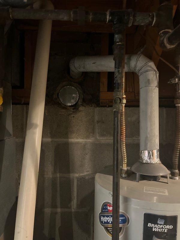 Conducted inspection of existing HVAC and water heating equipment in basement utility area. System evaluation included examination of furnace with connected ductwork, Bradford White water heater with Hydrojet technology, and associated PVC venting system. Photo documentation completed of all components and surrounding installation environment to support replacement estimate preparation.