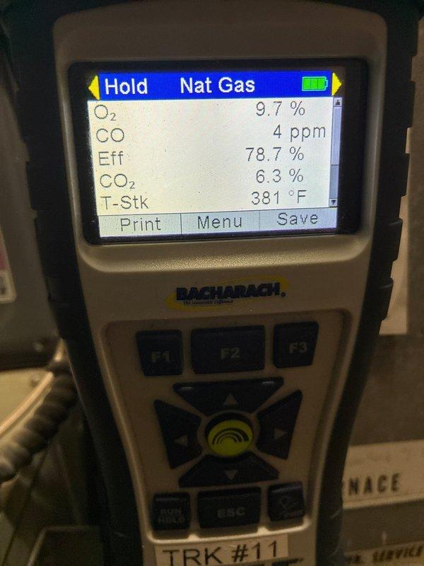 Completed fall maintenance on heating system. Performed combustion analysis using Bacharach gas analyzer, confirming proper operation with efficiency readings of 78.6-78.7%, CO levels at 3-4 ppm, and stack temperature at approximately 380°F. All readings within acceptable parameters for natural gas combustion.