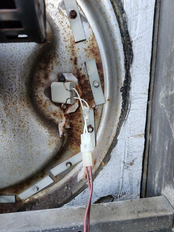 Responded to commercial rooftop furnace outage. Visual inspection revealed significant rust and corrosion on heat exchanger components with compromised electrical connections and wiring. Diagnosed failed heat exchanger as primary cause of system failure.