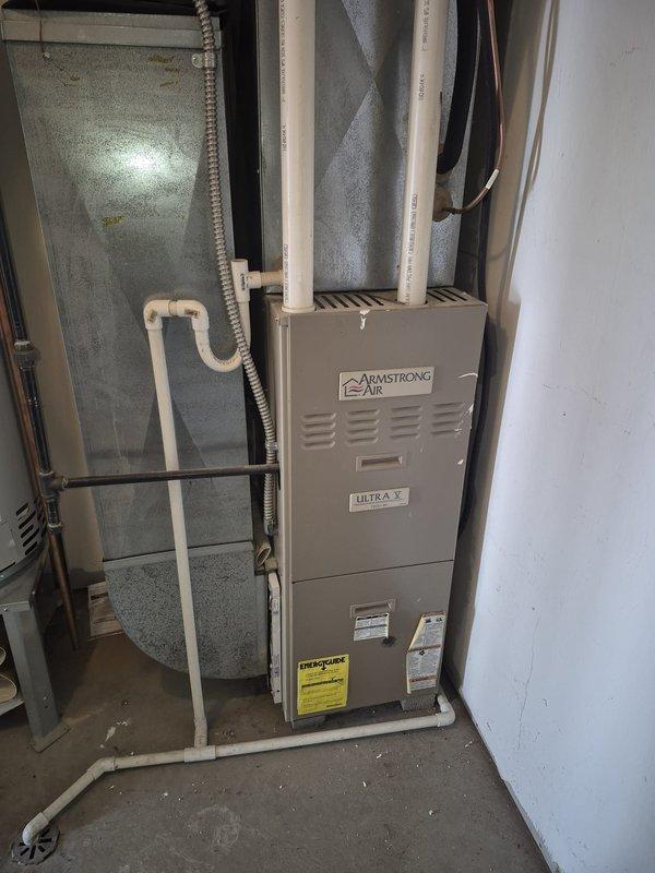 Responded to no-heat call for 20-year-old Armstrong Air Ultra V gas furnace that was completely non-operational. Upon inspection using digital camera equipment, discovered cracked heat exchanger causing system failure. Explained to customer that unit has exceeded expected service life and replacement is recommended due to safety concerns and inefficiency of repair on equipment of this age.