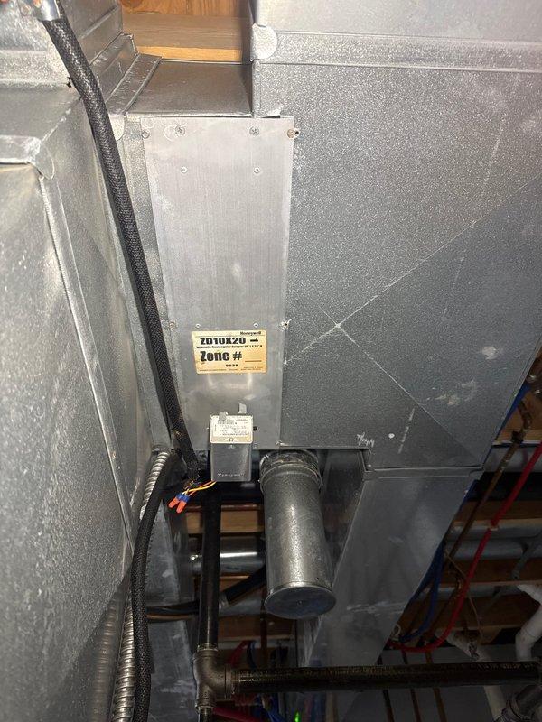 Responded to callback regarding non-functioning basement zone. Inspected York furnace system and identified issue with zone damper actuator (ID10KZ0). Reconnected loose wiring connections on the zone control module and verified proper operation of the basement zone damper. System now functioning normally with all zones responding correctly to thermostat calls.