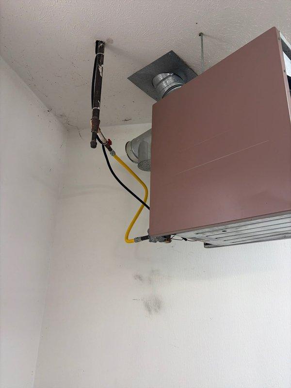 Successfully completed installation of a Mitsubishi mini-split system in client's home. Mounted the wall-mounted indoor air handler unit in the corner of a room and installed associated refrigerant lines with proper insulation. Connected system components including the condensate drain line and verified all connections were secure and properly sealed.