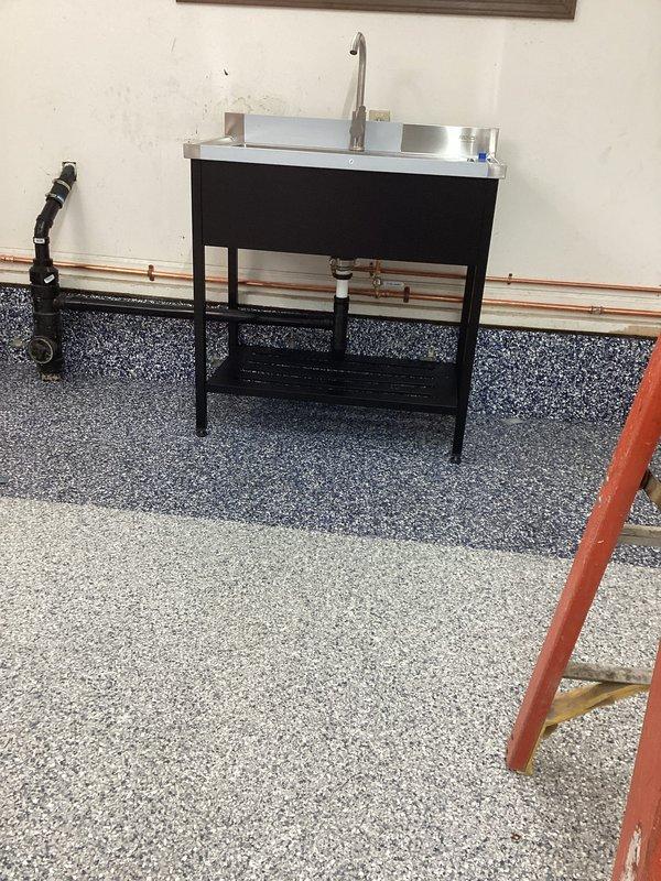 Successfully installed point-of-use Bosch water heater with proper copper pipe connections. Completed vent piping repairs to ensure proper ventilation. Installed utility sink with gooseneck faucet and stainless steel basin on black metal frame.