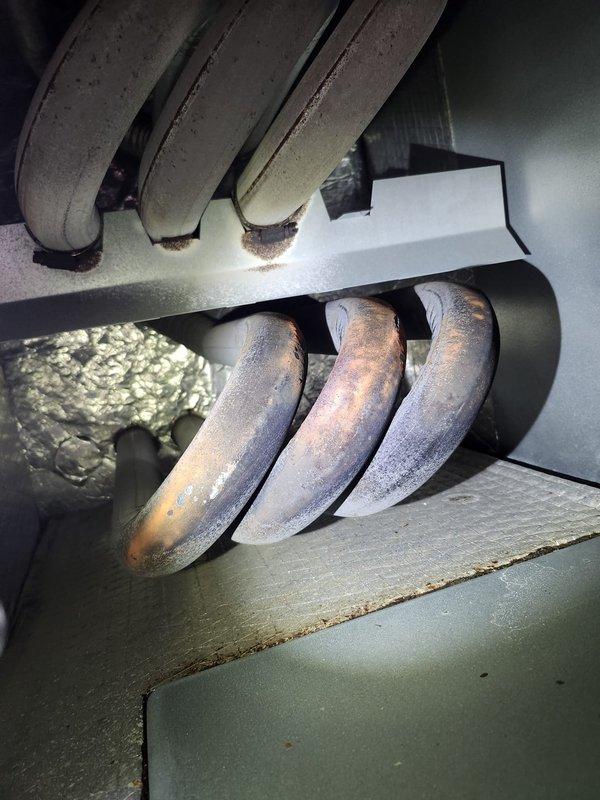 Responded to no heat complaint in Infinite Room. Inspection revealed significant heat exchanger deterioration with visible oxidation, discoloration, and rust formation on multiple tubes. Documented severe corrosion indicating potential safety hazard and imminent system failure. Recommended immediate replacement of heat exchanger or complete furnace unit.