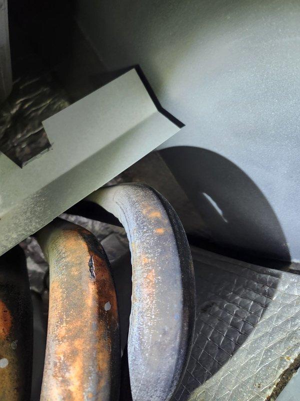 Responded to no heat complaint in Infinite Room. Inspection revealed significant heat exchanger deterioration with visible oxidation, discoloration, and rust formation on multiple tubes. Documented severe corrosion indicating potential safety hazard and imminent system failure. Recommended immediate replacement of heat exchanger or complete furnace unit.