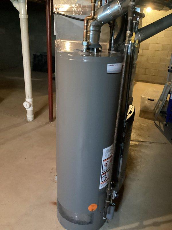 Inspected customer's bathroom faucet as requested. During service visit, also documented water heater system in basement which appears to be in good working condition with proper installation of expansion tank and all plumbing connections intact. No issues identified with the bathroom faucet that required immediate repair.