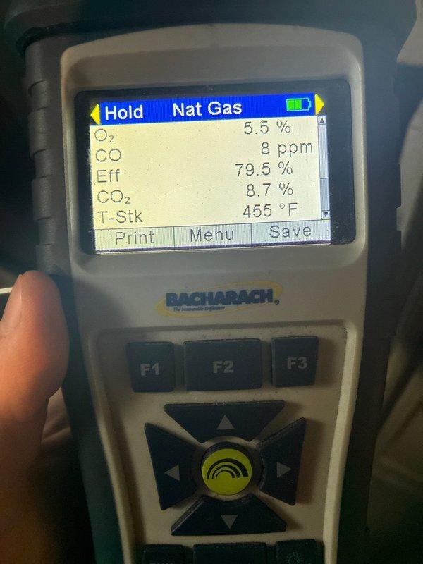 Performed routine heating maintenance service on residential system. Conducted combustion analysis using Bacharach analyzer, with readings showing proper operation (O₂: 5.4-5.5%, CO: 5-8 ppm, efficiency: 79.5-81.2%, CO₂: 8.7-8.8%, stack temperature: 398-455°F). System operating within normal parameters.