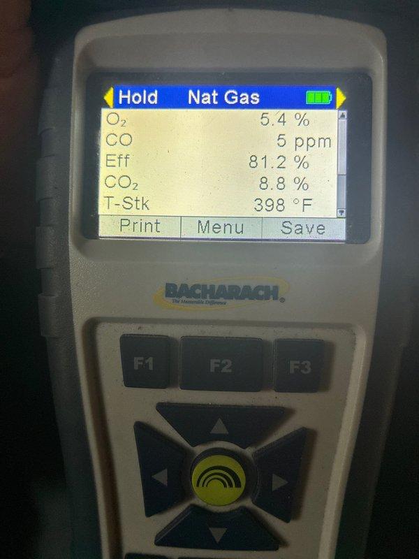 Performed routine heating maintenance service on residential system. Conducted combustion analysis using Bacharach analyzer, with readings showing proper operation (O₂: 5.4-5.5%, CO: 5-8 ppm, efficiency: 79.5-81.2%, CO₂: 8.7-8.8%, stack temperature: 398-455°F). System operating within normal parameters.