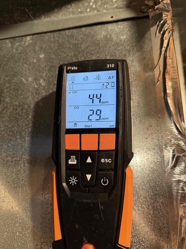 Performed routine maintenance on residential heating system per recurring service agreement. Conducted combustion analysis with Testo 310 analyzer, measuring CO levels at 29-44 ppm and O₂ at 7.0%. Applied caulking to furnace component as requested by customer to address sealing issue.