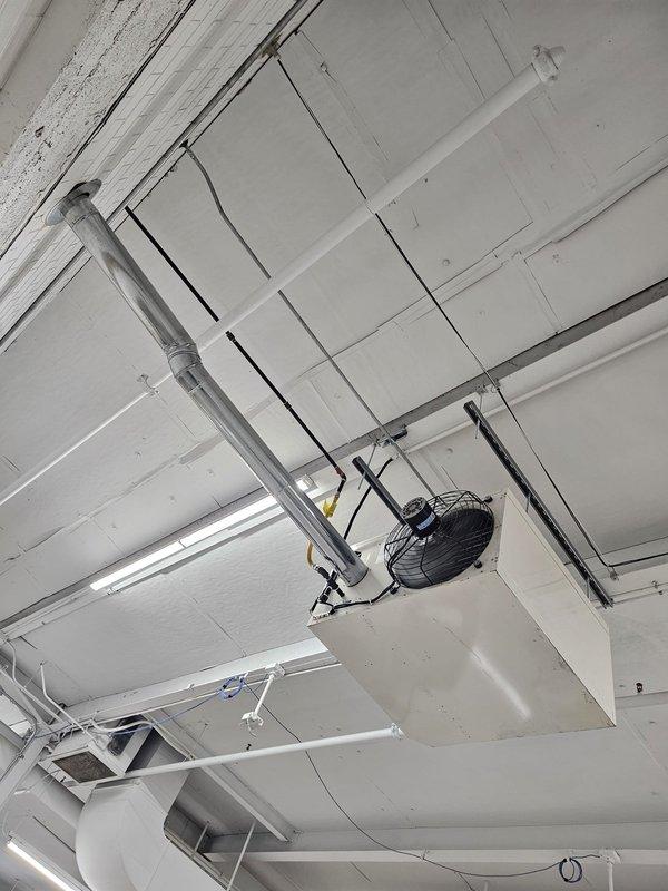 Successfully installed customer-supplied Reznor unit in commercial ceiling space, properly securing it with metal mounting brackets. Connected the unit to existing ductwork system and verified proper operation of the circular fan component.