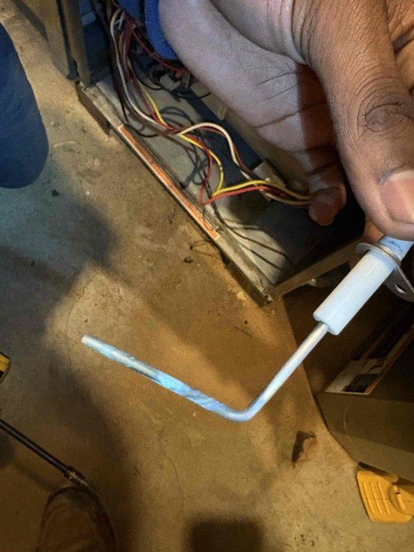 Performed fall maintenance on commercial HVAC system. Conducted temperature measurements using UEi PDT52A digital thermometer, recorded reading of 75.7°F. Inspected electrical connections and wiring, focusing on the red, yellow, and black wire bundles and associated copper components.