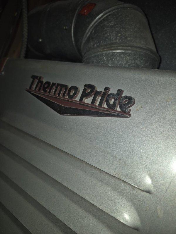 Performed maintenance service on a Thermo Pride furnace system. Inspected visible components including ductwork connections and exterior casing. Removed and examined fasteners during service, noting some surface rust on internal components that required attention.