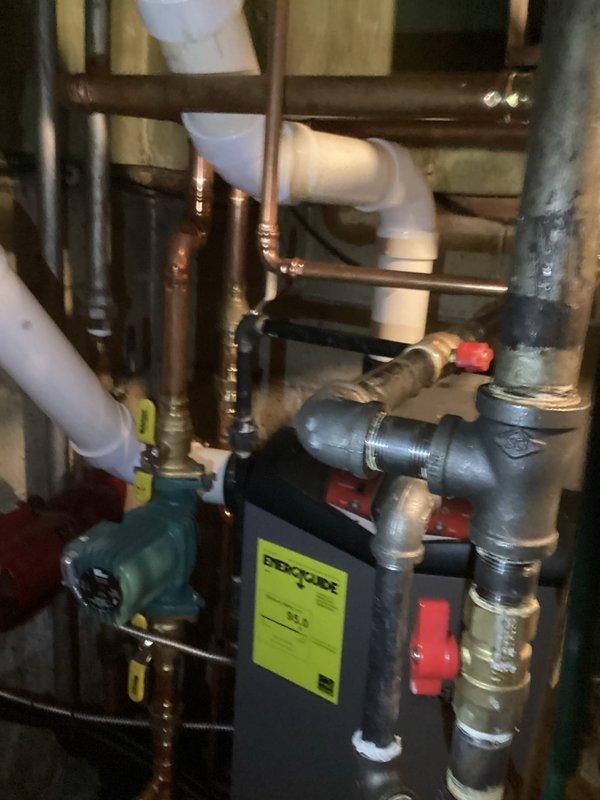 Performed clean and check service on two furnaces. Inspected boiler system, which includes copper and PVC piping, circulation pump, and expansion tank. All components appear to be functioning properly with no visible leaks or damage detected. System connections and valves were verified to be in good working condition.