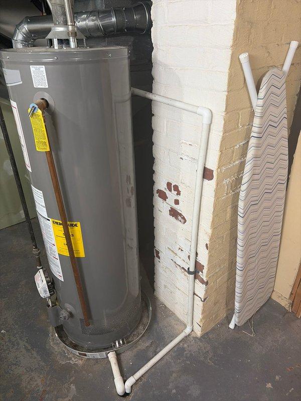 Completed retrofit installation of a Lennox furnace in basement utility room, connecting to existing ductwork system. Verified proper integration with Rheem water heater and ensured all ventilation components were properly sealed and functioning according to manufacturer specifications.