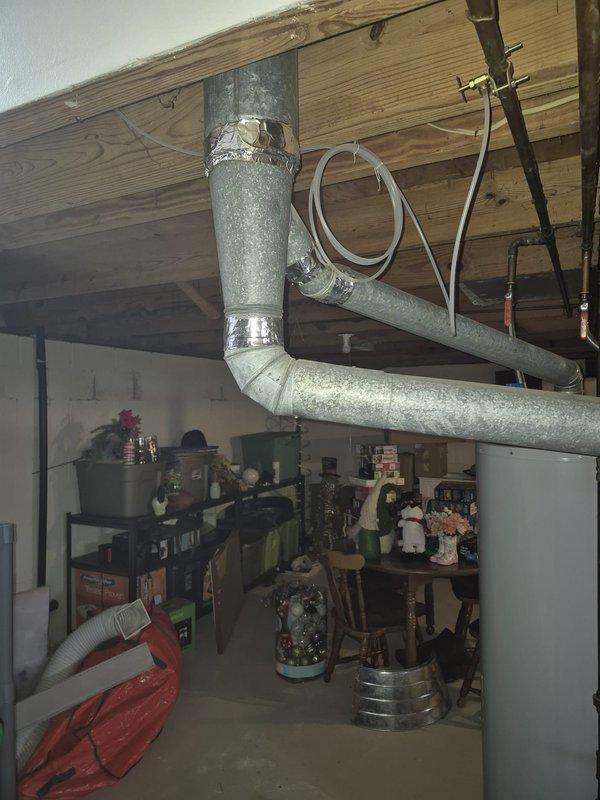 Responded to service call for non-functioning furnace from the 1980s with pilot light issues. Upon inspection of the olive green basement unit, diagnosed faulty pilot assembly. Replaced pilot assembly, cleaned burners, and verified proper ignition sequence. System now operating within normal parameters with strong, consistent flame pattern.