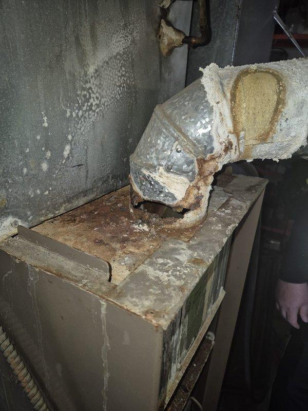 Responded to emergency service call for 27-year-old furnace with insufficient heat output (house at 60°F). Inspection revealed severe corrosion on heat exchanger, deteriorated ductwork connections, and compromised insulation. Determined unit has reached end of serviceable life due to extensive rust damage, potential safety hazards, and inefficient operation. Recommended complete system replacement.