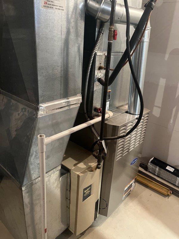 Completed replacement of aging Carrier furnace system (model #58sta090---12116, serial #3305a33590, manufactured August 2005) with new unit. Installation included proper connection of metal ductwork with sealed joints, installation of PVC condensate drain line, and connection of all necessary electrical components. System also features an integrated Aprilaire humidifier mounted to the side ductwork.