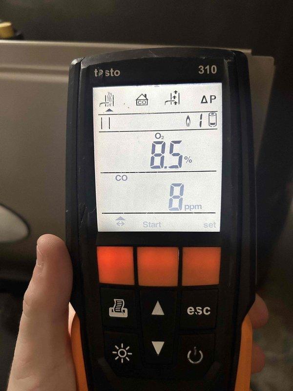 Performed Fall maintenance on heating system. Conducted combustion analysis using Testo 310 analyzer with readings showing optimal O₂ levels at 8.5% and safe CO readings at 0-14 ppm, confirming proper combustion and safe operation of the heating equipment.