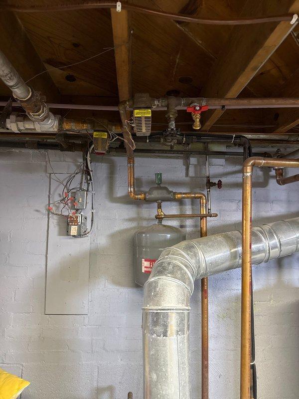 Responded to emergency service call for non-operational Crown boiler. Diagnosed failed circulator pump causing no heat distribution. Replaced pump, bled air from system, and verified proper operation of expansion tank. System now functioning with normal pressure and heat output.