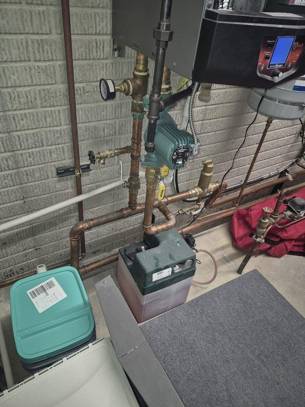 Responded to service call for 9-year-old ice melt boiler in lockout condition. Diagnosed system pump failure preventing proper operation through pre/post purge cycles. Inspected copper piping network, valves, and green circulator pump. Restored functionality by repairing circulation system components and verified proper operation of digital control unit.